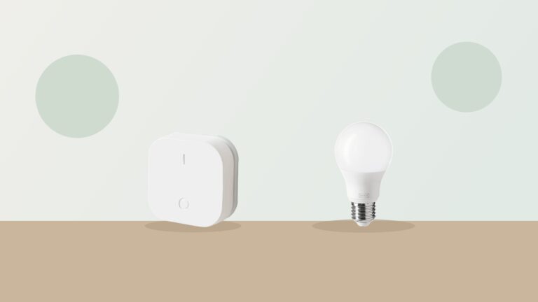 An IKEA Zigbee wireless button and smart bulb, the kind of secondhand devices a Touchlink reset applies to