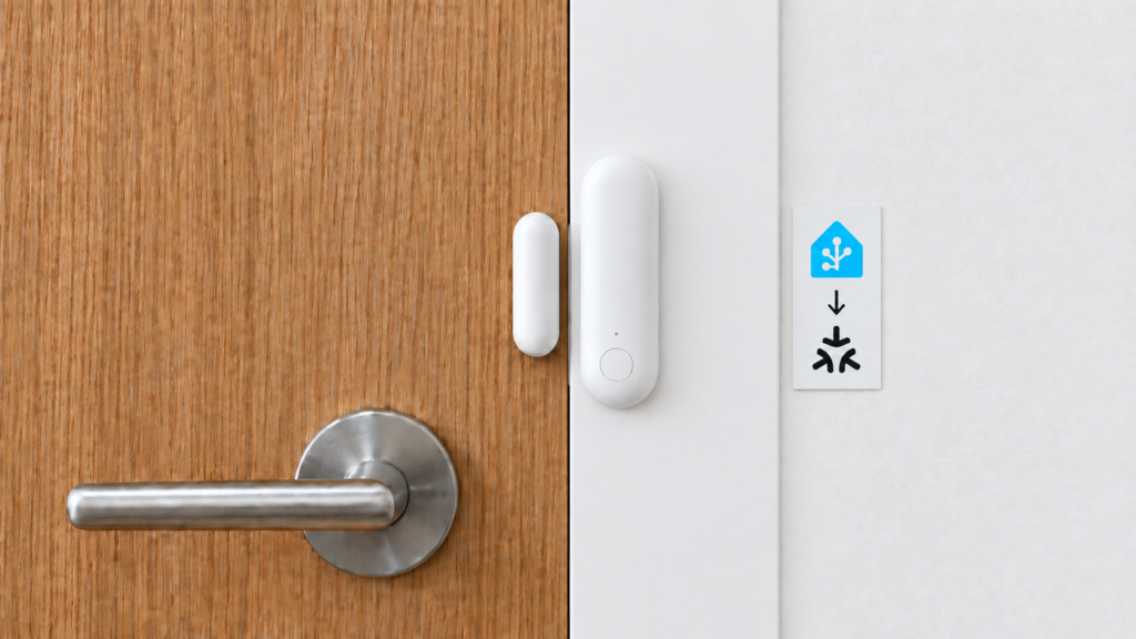 Aqara Door and Window Sensor P2 aligned on a closed door beside Home Assistant-to-Matter symbols.